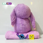 عروسک استیچ بچه بغل پتودار بنفش 55 سانتیمتر